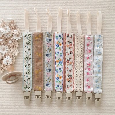 attache tétine fleur jolie différents motifs 