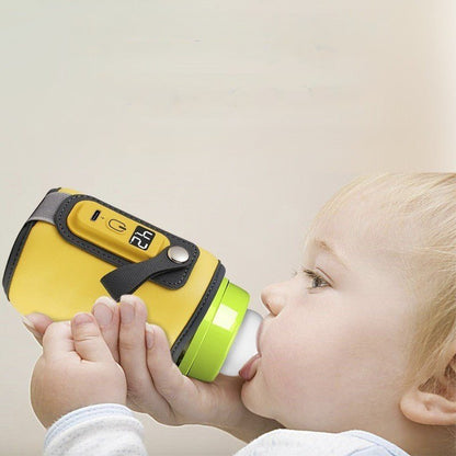 bébé boit du biberon dans chauffe biberon nomad easytemp 