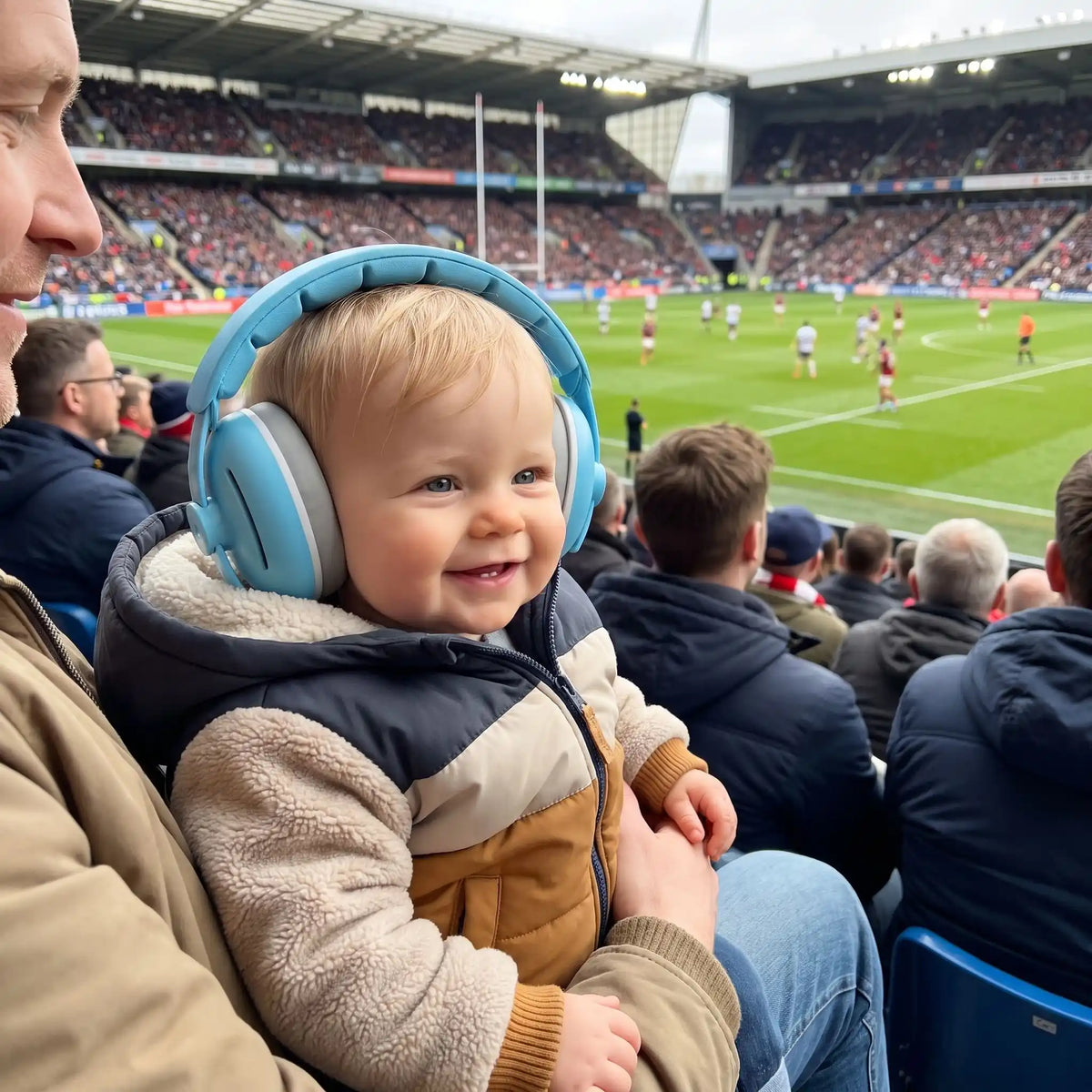 bébé porte casque anti bruit nourrisson light avec famille au stade