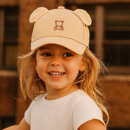 bébé souriant porte casquette pour bébé sunconfort