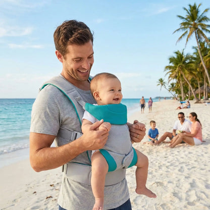 bébé dans porte bébé physiologique comfort sur la plage avec papa