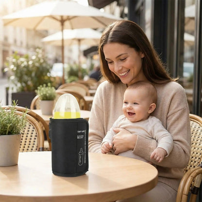 chauffe biberon nomade waterproof sur la table au café restaurant avec bébé et maman