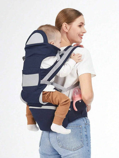 maman porte bébé au dos dans porte-bébé physiologique comfortplus 