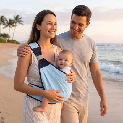 maman porte bébé dans l'écharpe porte bebe physioconfort sur la plage avec papa