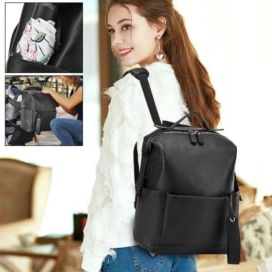 maman porte le sac à langer imperméable distingué noir sur le dos au salon