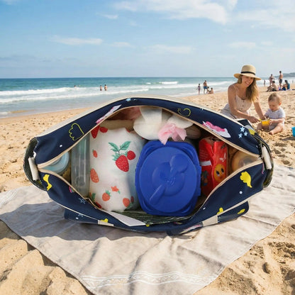 sac à langer bébé harmony sur la couverture avec maman et bébé sur la plage