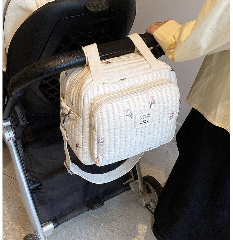 sac a langer sport chic floral attaché sur la poussette