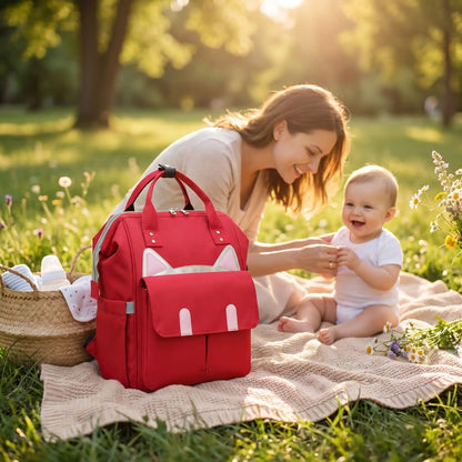 sac a langer urban chic parent sur la couverture avec maman et bébé
