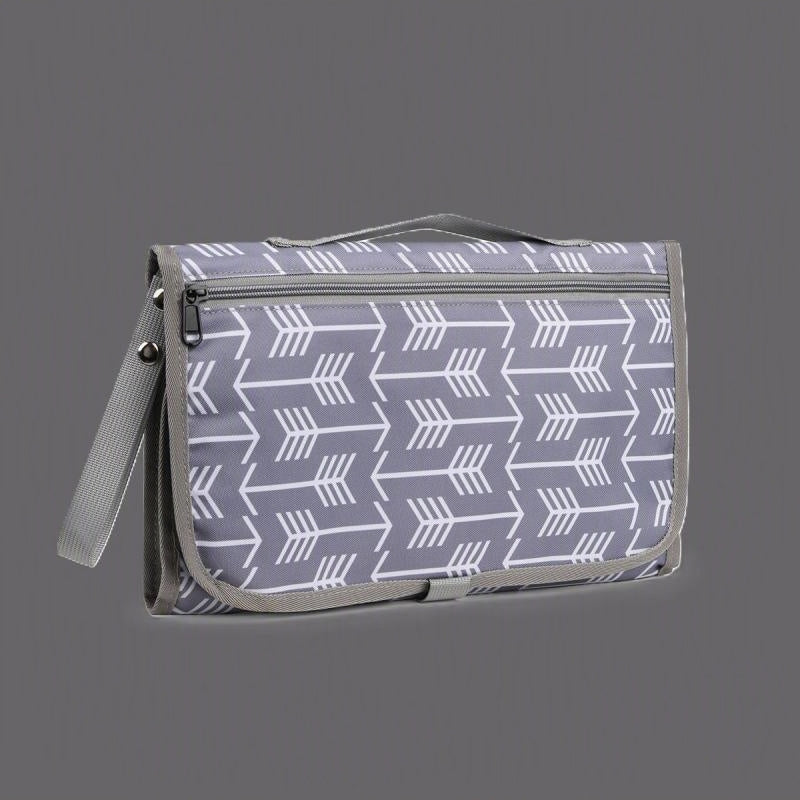 tapis à langer nomade avec poche babydoux