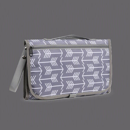 tapis à langer nomade avec poche babydoux